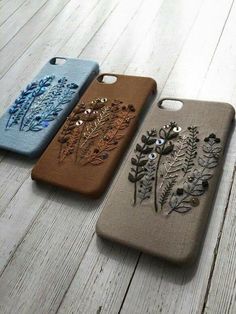 three iphone cases with designs on them sitting next to each other, one is made out of canvas and the other has sequins