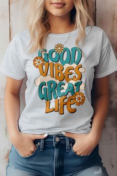 Hippie Style, Good Vibes Great Life, Graphic TeeThis item is made entirely from eco-friendly materials. It has a unisex fit that is true to size, with a crew neck and short sleeves. The shirt is crafted from superior combed and ring-spun cotton, with a 32 single 4.2 oz. Weight. It is side-seamed and has a retail fit, with shoulder taping for added comfort. The print is created using high-quality water-based ink, which is eco-friendly and leaves a soft touch on the fabric.Fabric Contents: 100% Airlume combed and ring-spun cotton Comfortable Crew Neck T-shirt With Letter Print, Casual Summer T-shirt With Lettering, Trendy Relaxed Fit T-shirt With Lettering, Trendy Summer T-shirt With Lettering, Gray Slogan T-shirt For Spring, Summer Short Sleeve T-shirt With Lettering, Spring T-shirt With Lettering, Summer Gray T-shirt With Slogan, Spring Short Sleeve T-shirt With Lettering