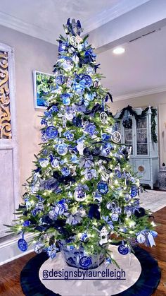 a blue and white christmas tree decorated with ornaments