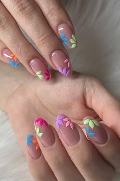 A garden of beauty on your fingertips. Discover the allure of delicate floral artistry with these Subtle Floral Nail Designs. With vibrant petals and a soft pink base, these blooming nails will transport you to a spring garden. 🌺🌸🌼💅 // Photo Credit: Instagram @manuelanails__ Spring Acrylic Nails With Flowers, Hot Pink Green Nails, Neon Flower Nail Art, Floral Nail Art Designs Summer, Almond Flower Nails Designs, Ombre Floral Nails, Colourful Flower Nails, Colorful Floral Nails, Flower Manicure Designs