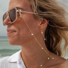 LAST CHANCE - THIS ITEM WILL NOT BE RESTOCKEDWear on your sunglasses or AirPods to keep them safe and stylish! 18K Gold-Plated Stainless Steel Fresh Water Pearls Nickel-Free Lead-Free Hypoallergenic Lobster Clasp 29.5" Chain Adjustable Sunglass Chain Loop Water Resistant Trendy Gold Glasses Chains For The Beach, Elegant White Glasses Chains For The Beach, Elegant Glass Glasses Chains For Beach, Everyday Glass Jewelry For Summer, Modern Adjustable Gold Glasses Chains, Elegant Everyday Glasses Chains For Summer, Gold Glasses Chains For Summer Beach, Gold Glasses Chains For Beach And Summer, Elegant Summer Glass Necklaces