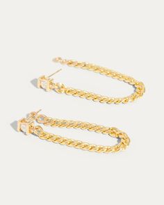 Our Channel Set Diamond Chain Earring is a 3 in one earring. The curb link chain is set with a jump ring at the end, allowing it to be moved from one ear piercing to another. The most perfect chain earring you will own and love to style. Make it your own style, put a twist to your everyday earring stack. 14K Yellow Gold Sold Individually (NOT as a pair) 3 mm channeled diamond 0.10 Ct G/SI1 2.5" Length curb clink chain 3mm width Post Push Back IN STOCK AND READY TO SHIP One Ear Piercing, Earring Stack, Chain Earring, One Earring, Diamond Chain, Sell Gold, Ear Piercing, Channel Set, Everyday Earrings