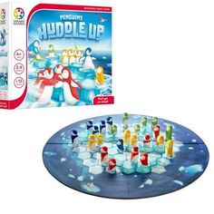 the penguinie huddle up board game is shown in front of an open box