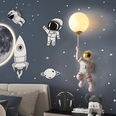 an astronaut wall mural in a child's bedroom