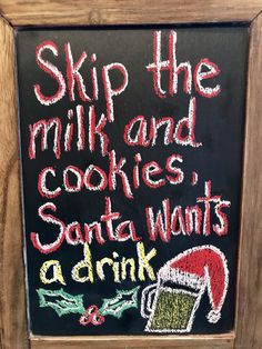 a chalkboard sign that says, skip the milk and cookies santa wants a drink