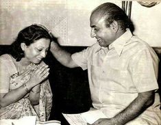 an old photo of a man and woman sitting together