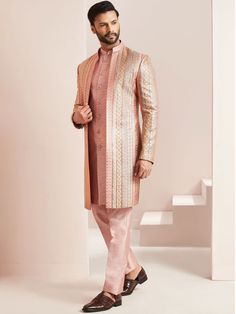 Peach colour Front Open Jacket style indo western sherwani in Silk designed with Different cut enhanced by front all over work embroidery in zari & thread on .Suitable for Indian Weddings, Bollywood parties and Indian Ceremonies, Perfect for Groom or Groomsmen,designer jacket style indowestern,designer wear for mens,designer outfit for groom COST INCLUDES INDOWESTERN JACKET,INSIDE JACKET & TROUSER Designer Pink Sherwani With Pallu, Pink Bandhgala With Dabka Work In Traditional Drape, Designer Pink Sherwani With Pallu Detail, Pink Bandhgala With Dabka Work For Reception, Fitted Pink Sherwani With Dabka Work, Pink Sherwani With Dabka Work, Pink Fitted Sherwani With Dabka Work, Bollywood Style Pink Bandhgala With Dabka Work, Pink Long Sleeve Sherwani With Dabka Work