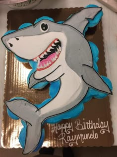 a birthday cake with a shark on it