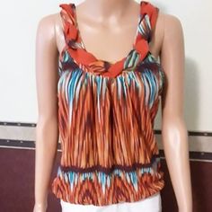 Beautiful Multi Colored Sleeveless Slip Over Dressy Top With Tie Bow At Back Of Neck, Has Elastic As Bottom That You Can Pull Up To Waist To Make Blousy Effect Or It Can Hang Lower, Size Medium. Both Shell And Lining Are 100% Polyester, Machine Wash Cold Tumble Dry Low Remove Immediately And Hang. Measures Arm Pit To Arm Pit 18" With Stretch And Is Approximately 26"Long. Black Ruffle Blouse, Boho Style Tops, Maroon Blouse, Teal Blouse, High Low Blouse, Bow Shirts, Lace Caps, Animal Print Blouse, Tie Bow