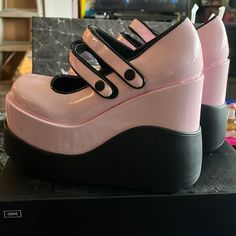 Brand New Never Been Worn Super Cute Platform Maryjanes. The Pink And Black Look So Cute Together. The Straps Are Velcro. Comes With The Original Box. Pink Mary Jane Heels With Round Toe, Pink Mary Jane Heels With Platform, Pink Mary Jane Platform Heels, Pink Retro Closed Toe Heels, Pink Mary Janes For Spring Party, Retro Pink Ankle Strap Heels, Pink Patent Leather Heels With Round Toe, Pink Retro Heels With Synthetic Material, Spring Low-top Mary Janes