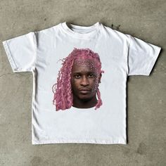 a t - shirt with an image of a man with pink hair