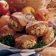 a white plate topped with rolls and apples