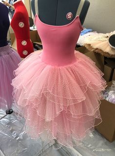 Stretch Petaled Flower Romantic Tutu Course was developed for those who are interested in making tutus using stretch materials but want to preserve more of the polished, professional quality “look” than the stretch tutus and children’s tutus currently available on the market today. You will make a beautiful, professional-quality 10-Layer Roll-Hemmed Romantic Flower Tutu skirt, attached to one of five style choices for the stretch leotard top. Students MUST have experience sewing stretch fabrics, Fitted Ballet Tutu Dress For Summer, Fitted Tutu Dress For Summer Dance, Fitted Summer Ballet Tutu Dress, Fitted Pink Balletcore Tutu Dress, Pink Fitted Balletcore Tutu Dress, Fitted Tulle Tutu Dress For Dance, Pink Fitted Ballet Tutu Dress, Making Tutus, Pink Boa