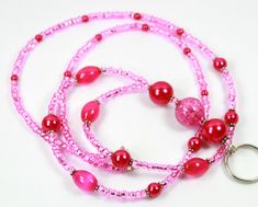 "\"PERFECT FUCHSIA\" This beautiful fuchsia or pink badge holder is perfect for pink lovers.  This is my personal favorite.  It is made of fuchsia glass pearls, cats eye, pink bead, and small beads.  It measures 19 inches long.  If you need different size just convoy me the message. This lanyard will come in lobster clasp.  You can choose a different clasp for the options. Thanks, for shopping with us!" Pink Beaded Lanyards For Gifts, Lanyard Pink, Pink Lanyard, Beaded Lanyard, Beaded Lanyards, Small Beads, La Rose, Cats Eye, Pink Beads