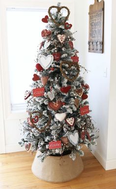 a decorated christmas tree with hearts on it