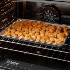 a pan filled with food sitting inside of an oven