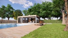 a pool house with a wooden deck next to it and a swimming pool in the background