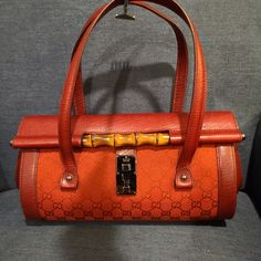 Authentic Red Gucci Handbag. Bamboo Detail. Red Cloth With Red Leather. Brand New. Never Been Used. Comes With Original Dustbag. Length 12.25" X Width 5.25" X Height 7" Gucci Handheld Shoulder Bag, Designer Handheld Bags With Bamboo Handle, Gucci Rectangular Satchel For Evening, Rectangular Gucci Satchel For Evening, Gucci Rectangular Evening Satchel, Luxury Satchel With Bamboo Handle For Shopping, Designer Handheld Shoulder Bag With Bamboo Handle, Gucci Handheld Shoulder Bag For Formal Occasions, Gucci Formal Handheld Shoulder Bag