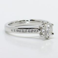 a white gold engagement ring with diamonds on it