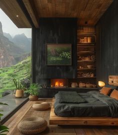 a bedroom with a large bed sitting next to a fireplace in a room filled with wooden floors