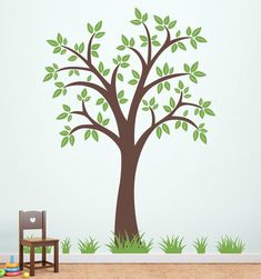 a tree with green leaves on it in a child's room wall decal