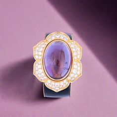 Discover the timeless elegance of our Estate Jewelry Collection with this exquisite vintage bracelet from the 1980s. Crafted from luxurious gold, this piece showcases a magnificent oval cabochon amethyst weighing approximately 87.00 carats, radiantly framed by 64 sparkling round diamonds totaling about 11.90 carats. Th Hermes Jige, Classic Glamour, Vintage Bracelet, The 1980s, Vintage Bracelets, Jewelry Vintage, Oval Cabochon, Anemone, Estate Jewelry