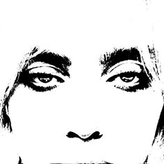 a black and white photo of a woman's face with her eyes wide open