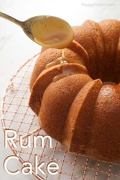 a bundt cake on a wire rack with a spoon