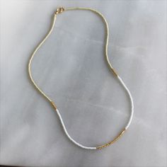 Our lithe necklace is handcrafted with a touch of gold in a minimalist style. •Seed beads in your choice of color combination •Hand strung in a modern pattern•14kt Gold-Filled beads & spring clasp •16 inches in length or 16 inches with a 2 inch extender Everyday Beaded 14k Gold-filled Necklaces, Everyday Beaded 14k Gold-filled Necklace, Everyday Beaded 14k Gold Filled Necklace, Everyday Colorful Beaded 14k Gold Filled Jewelry, Everyday Jewelry With Colorful 14k Gold Filled Beads, Everyday 14k Gold-filled Jewelry With Colorful Beads, Minimalist 14k Gold-filled Beaded Jewelry, Minimalist 14k Gold Filled Beaded Jewelry, Everyday 14k Gold Filled Beaded Necklace