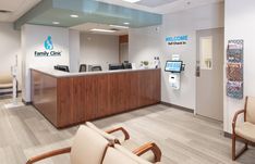 an office lobby with chairs and a reception desk in front of the door that says family clinic