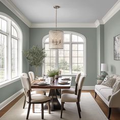 a dining room table with chairs and a chandelier