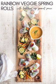 rainbow veggie spring rolls with lightened dipping sauce on a wooden platter