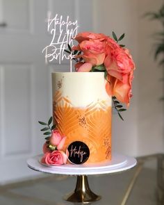 a birthday cake decorated with flowers and a happy 21st birthday sign on top is shown