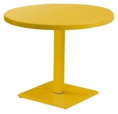 a yellow round table with a metal base on an isolated white background for display purposes