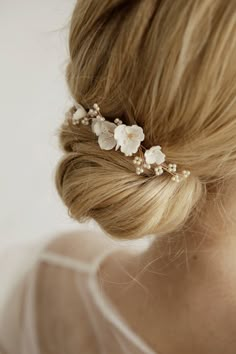 Delicate and stunning floral comb is crafted with handmade Porcelain flowers and small matte beads. Use this flower hair comb to accentuate an updo or add a whimsical touch to loose waves. So small the comb is well attached and holds even on short hair (if necessary, it can be fixed with a bobby pin). This bridal hair piece is versatile and can complement any wedding gown design. Available on silver and gold wire. Length: 9 cm ( 3.5 inch) If you like this bridal hair comb, I recommend that you s Bridal Hair Piece Short, Minimal Bridal Hair Piece, Bridal Hair With Hair Comb, Bridal Hair Accessories Updo, Low Bun Wedding Hair With Flowers, Wedding Bun With Flowers, Flower In Hair Wedding, Gold Hair Piece Wedding, Boho Wedding Hair Flowers