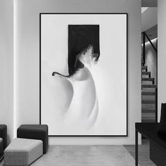 a black and white photo hanging in a living room