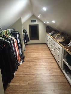 the closet is full of clothes and shoes