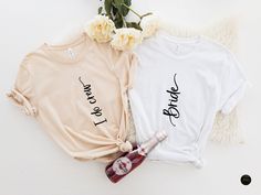 two t - shirts that say i love you and the other one has a bottle of booze