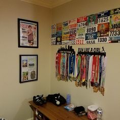 there are many medals hanging on the wall in this room, and one is for sale