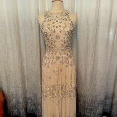 a dress on display in front of a curtain