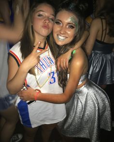 two girls hugging each other at a party