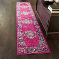 a bright pink runner rug in a living room