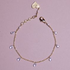 This Dainty Crystal Drop Bracelet is sure to make a statement! Crafted with a beautiful array of glimmering stones, it'll have you twinkling like a diamond. Elevate your style and be the spotlight of the night with this sparkly bracelet! *Adjustable Bracelet 6"-7" (Sizes Available) *Cubic Zirconia Drop Crystals *18k Gold Plated or Stainless Steel *Lead and Nickel free, Hypoallergenic *Handmade in Los Angeles Adjustable Chain Bracelet With Sparkling Stones For Party, Sparkling Crystal Bracelets As Gift, Sparkling Crystal Bracelet As Gift, Sparkling Crystal Bracelets Gift, Dainty Adjustable Crystal Bracelet For Party, Adjustable Crystal Bracelets With Jewels, Cubic Zirconia Dangle Bracelets, Dainty Party Crystal Bracelet With Cubic Zirconia, Dainty Adjustable Bracelet With Sparkling Stones