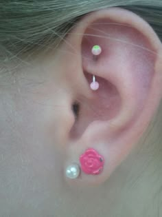 the ear is decorated with pink and green beads