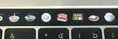 the keyboard is decorated with pictures of different foods and drinks on it's keys