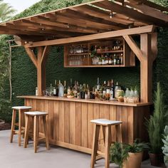 an outdoor bar with wooden shelves and stools