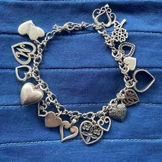 Shiny And Recently Polished This Authentic James Avery Heart Charm Bracelet Dazzles! Expect To Be Stopped As Others Admire Your One Of A Kind Collection Of Hearts When They See And Hear The Soft Swish Of Charms Encircling Your Wrist. Hurry, With Valentine's Day Fast Approaching, This One Of A Kind Bracelet Won't Last Long! Featuring 16 Charms, 15 Stamped With The James Avery Logo, Marked 925 Or Imprinted With The Designer’s Name, 1 Charm Is Not James Avery- It Is The Puffy Heart On The Left Side Of The Photo. Includes Rare And Retired Charms! Non-Detachable Safety Chain Included. Secure Working Clasp, Stamped Avery, 925. Measures Approx 7.5” Around With Claps Closed. Measurements A James Avery Charm Bracelet, Pandora Bracelet Charms Ideas, James Avery Charms, James Avery Jewelry, Bracelet Charms, Pandora Bracelet Charms, The James, James Avery, Safety Chain