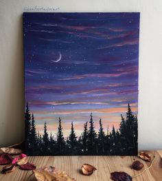 an acrylic painting of the night sky and trees