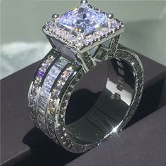 an engagement ring is shown on display with the price tag for $ 999 00