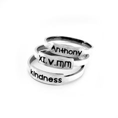 Simple little engraved rings handcrafted from sterling silver. Customize your rings to reflect what is important to you. Perhaps your children's names, an anniversary date or bible verse. We have given the band a rustic feel with darkened edges and a brushed finish. They will arrive ready to present as a gift. Band: 2mm wide, 1mm thick Made to order. Allow up to 14 business days for fabrication before shipment. There is a charge for the re-sizing of rings, please make sure of your proper ring si Birthstone Ring Mothers, Birthstone Stacking Rings, Hand Stamped Ring, Stamped Rings, Sterling Silver Stacking Rings, Mother Rings, Hammered Rings, Sterling Silver Rings Bands, Silver Stacking Rings